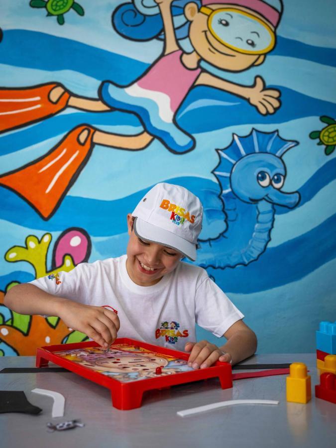 Las Hadas By Brisas Manzanillo Exterior photo Child at the DREAMS Center